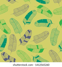 Tropical banana leaves hand drawn contours seamless pattern on yellow background, vintage style.
