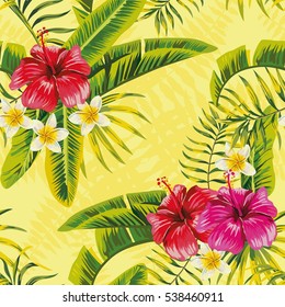 Tropical banana palm leaves and flowers hibiscus plumeria seamless pattern on yellow background