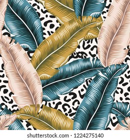 Tropical banana palm leaves, leopard animal print background. Vector seamless pattern. Graphic illustration. Exotic jungle plants. Summer beach floral design. Paradise nature