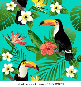 Tropical birds and palm leaves seamless background. Toucan. Vector.