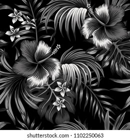 Tropical black and white hibiscus and plumeria floral palm leaves seamless pattern black background. Exotic wallpaper