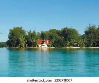Tropical coastline with a house by the sea in Palau, Micronesia. Sunny day view.