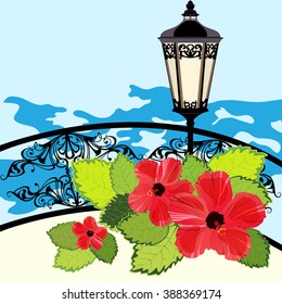 Tropical coastline with lantern, fence and flowers