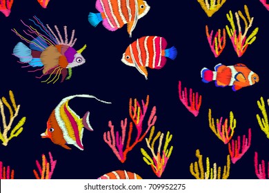 Tropical deep lagoon. Seamless vector pattern with stylized embroidered texture. Multicolored exotic fishes and corals on dark blue background. Beach textile collection.