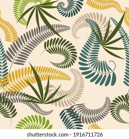 Tropical design. Colored leaves on a light background.