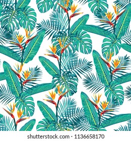 Tropical design featuring Palm Fronds, Monstera Leaves and Bird of Paradise Flowers. Seamless vector pattern background.
