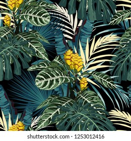 Tropical exotic floral green and blue monstera palm leaves seamless pattern, yellow flowers. Exotic jungle wallpaper on black background.