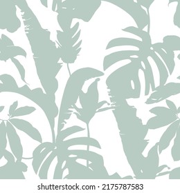 Tropical exotic floral silhouette mint palm leaves seamless pattern background. Exotic jungle wallpaper.	