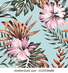 Tropical floral pink hibiscus flower orange palm leaves seamless pattern blue background. Exotic jungle wallpaper.