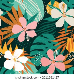 Tropical flowers and artistic palm leaves on background. Seamless. Vector pattern.