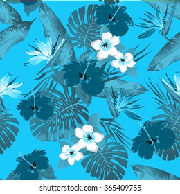 Tropical flowers and leaves on blue background. Seamless. Vector.