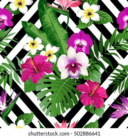 Tropical flowers and leaves on geometric background. Seamless. Vector.