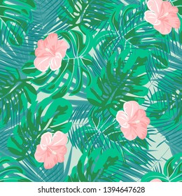 Tropical flowers and leaves of plants jungle vector seamless pattern. Exotic floral print for swimsuits, fabrics, wallpapers. Floral background with ethnic leaves and flowers.
