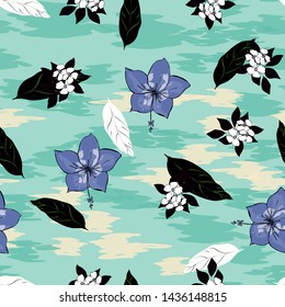 Tropical flowers and leaves of plants jungle vector seamless pattern. Exotic floral print for swimsuits, fabrics, wallpapers. Floral background with ethnic leaves and flowers.