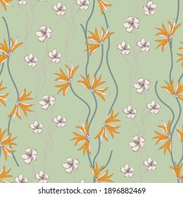 Tropical flowers on a green background, seamless floral print. Vector pattern for fabric.