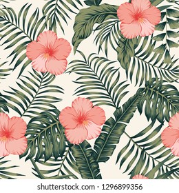 Tropical flowers red and white hibiscus on the green palm banana leaves seamless vector pattern. Exotic botanical background