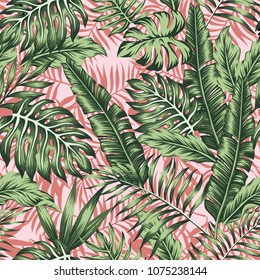 Tropical green leaves jungle pink plants background