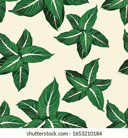 Tropical jungle plants, exotic leaves on yellow background. Beach seamless pattern.
