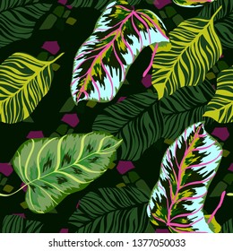 Tropical leaves floral print exotic seamless pattern. The texture of the fabric leaves of banana and palm trees. Exotic Hawaiian print for swimsuits.