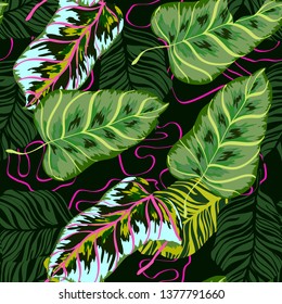 Tropical leaves floral print exotic seamless pattern. The texture of the fabric leaves of banana and palm trees. Exotic Hawaiian print for swimsuits.