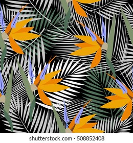 Tropical leaves and flowers of palm tree. Seamless pattern. Vector background.