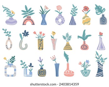 Tropical leaves, foliage and flowers in ceramic vases