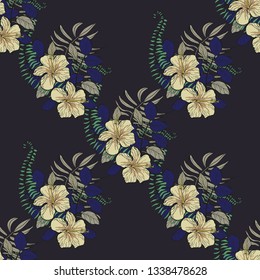 Tropical leaves and hibiscus flowers are an exotic pattern on a dark background. Exotic seamless pattern with tropical leaves. Ethnic Background with Hawaiian flowers and plants.