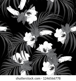 Tropical leaves and hibiscus flowers monochrome seamless pattern in black and white style. Beach wallpaper.