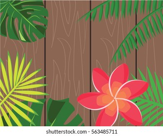 Tropical leaves pattern with wooden background
