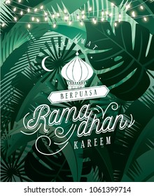 tropical leaves ramadan greetings template vector/illustration with malay words that mean 'happy fasting','blessed ramadan'