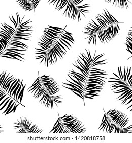 Tropical leaves seamless pattern. Exotic palm leaf silhouette. Vector illustration.
