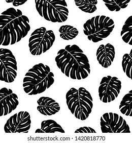 Tropical leaves seamless pattern. Exotic palm leaf silhouette. Vector illustration.
