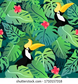 Tropical leaves seamless pattern with hornbill. Summer vector background
