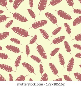 tropical leaves seamless pattern on light pastel yellow background