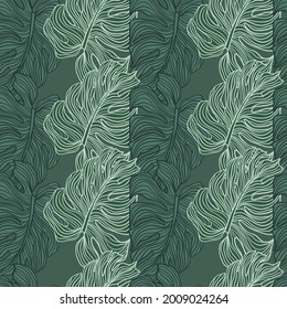 Tropical leaves silhouette seamless pattern. Wallpaper with green monstera leaf. Hand drawn tropic foliage. Exotic green background.Trendy design for fabric, textile print, wrapping paper