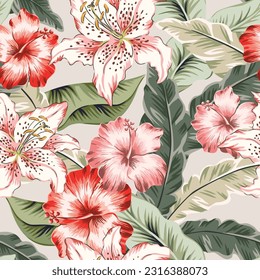 Tropical lily and hibiscus flowers, palm leaves, light beige background. Seamless pattern. Vector illustration. Exotic plants. Summer beach floral design. Paradise nature