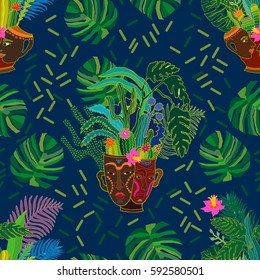 Tropical magic forest. Seamless vector pattern with exotic plants in ceramic pots with aboriginal faces and palm leaves. Ethnic textile design collection. Colorful on dark blue.
