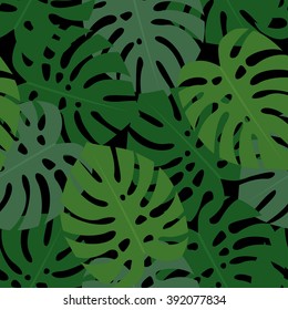 Tropical monstera leaves seamless pattern on black background. Green palm leaves background. Trendy Jungle illustration. Design for fabric and decor.
