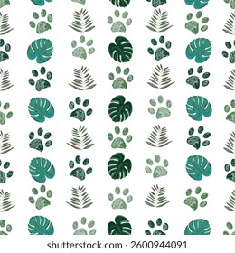 Tropical monstera and palm leaves and paw prints. Seamless fabric design pattern
