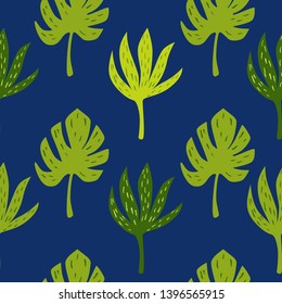 Tropical palm and jungle green leaves. Seamless background for fabric, wallpaper and textile. Vector isolated hand drawn elements on the dark blue background.