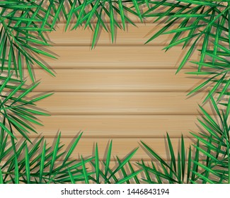 Tropical palm leaves and jungle plants on wood planks background.