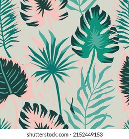 Tropical palm leaves, jungle leaves seamless vector  pattern. Palm and monstera dense jungle. Ideal for textile. Summer background in pastel colors