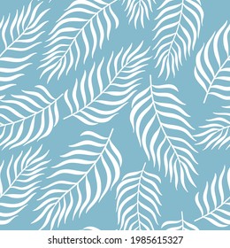 Tropical palm leaves seamless pattern. White plants on blue background