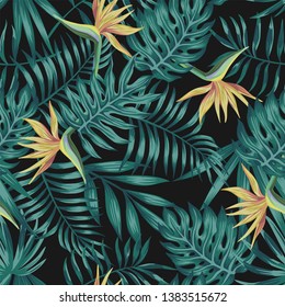 Tropical palm, monstera, fern leaves blue tone and bird of paradise flowers on the black background. Seamless vector pattern