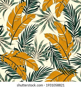 Tropical pattern with abstract plants and leaves on a yellow background. Hawaiian style. Seamless pattern with colorful leaves and plants. Colorful stylish floral.