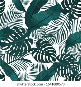 Tropical pattern with green  monster leaves, banana leaves and palm leaves overlapping  on white background. Seamless vector pattern.