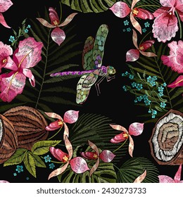 Tropical pattern. Pink orchids flowers, dragonflies, coconut and palm leaves seamless background. Fashionable template for design of clothes, textiles. Embroidery. Jungle night