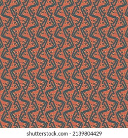 Tropical pattern with zigzags and pixels, colored in dark blue and orange. Textile design.