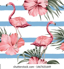 Tropical pink hibiscus and flamingo floral green palm leaves seamless pattern striped background. Exotic jungle wallpaper.