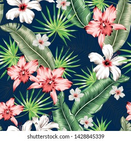 Tropical pink orchid, white hibiscus flowers, banana palm leaves, navy background. Vector seamless pattern. Jungle foliage illustration. Exotic plants. Summer beach floral design. Paradise nature